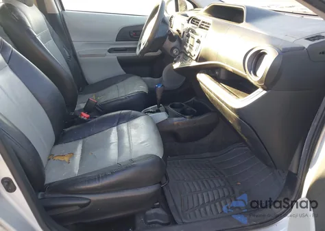 2014 Toyota Prius C One from USA, damaged, VIN JTDKDTB37E1062017